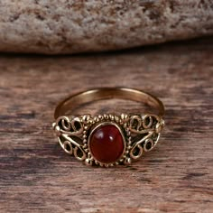 "Red Onyx Ring, Gold Ring, Gemstone Ring, Statement Ring for Women, Handmade Ring, Brass Ring, Designer Ring, Promise Ring, Boho Ring Size:- All Size Available In Variation Metal:- Brass Stone:- Red Onyx 1 product free gift on purchase of 3 products. You can choose the plain brass ring free gift as your wish. Take a screenshot of plain brass ring you like from my shop and send me a photo in personal message. MUST READ....👇 5 stars is my shop's priority. So contact me before leaving any negative Red Gemstone Toe Ring, Handmade Red Toe Ring, Spiritual Ruby Rings In Red, Red Vintage Crystal Promise Ring, Vintage Red Crystal Promise Ring, Spiritual Red Ruby Rings, Vintage Red Crystal Gemstone Ring, Bohemian Ruby Ring With Gemstone, Bohemian Ruby Gemstone Rings