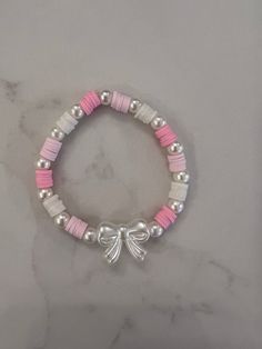 Beaded bracelet with bow bead. Ships only to US. No returns. Cute Bracelet Ideas Pink, Cute Bracelet Ideas With Clay Beads, Cute Bracelet Ideas For Best Friends, Jewelry Clay Beads, Bracelet Perle Aesthetic, Cute Pearl Bracelet Ideas, Cute Clay Bead Bracelet Ideas Aesthetic, Bracelet Pearls, Cute Clay Bracelets