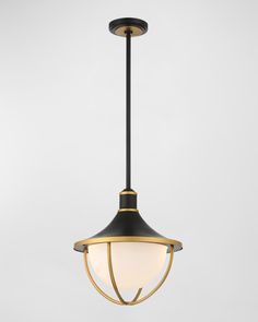 a black and gold hanging light with a white glass shade on the top, against a gray background