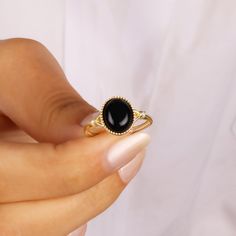 BLACK ONYX RING - ONYX RING - MİNIMALIST ONYX RING This minimalist black onyx ring will be a perfect gift as a christmas for your best friend.Tigers eye ring with made of gold plated 18 karat .925 sterling silver. In ancient Indian and Persian tales Onyx is referred to as a protector from evil. The Indian gemologists describe onyx as a protector for harmonious relationships. The stones' close union and yet strong contrast between the layers of black and white are considered symbolizing for the l Black Open Stackable Rings As Gift, Black Open Stackable Rings For Gift, Black Birthstone Rings For Gifts, Black Birthstone Rings, Adjustable Black Midi Rings For Gift, Black Open Midi Rings For Promise, Black Open Midi Ring For Promise, Black Birthstone Ring Gift, Minimalist Onyx Jewelry Gift