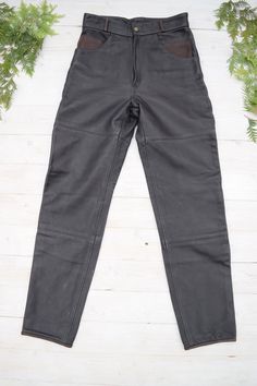 "Strong un and thick leather moto pants in excellent condition. PLEASE CHECK ALL MEASUREMENTS BELLOW: Length: 106 cm / 42\" Waist: 72 cm / 28\" Hips: 102 cm / 40\" Inseam: 77 cm /30\" Fabric: leather, polyester Brand: Frank Thomas Condition: excellent * dry clean only LOOK FOR OTHER COOL VINTAGE CLOTHING HERE: https://www.etsy.com/shop/OnTheRoadStore KEEP IN MIND: Photo might be slightly different from actual item in terms of color due to the lighting during photo shooting or your monitor's disp Biker Style Full-length Leather Pants For Biker Events, Full Length Biker Leather Pants For Biker Events, Black Moto Straight Leg Pants, Black Straight Leg Moto Pants, Black Moto Style Straight Leg Pants, Black Leather Moto Bottoms, Black Biker Leather Pants Full Length, Black Fitted Leather Pants For Motorcycling, Fitted Black Leather Pants For Motorcycling