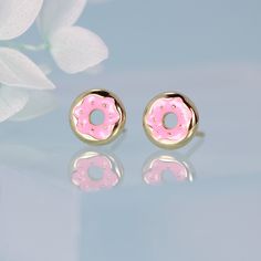 These donut earrings are a sweet treat for your ears. Made from solid sterling silver with a gold plated donut shape and your choice of strawberry frosting or chocolate frosting enamel colors, these funny donut stud earrings make a playful accessory for any occasion. Whether you're celebrating National Donut Day or just want to add a touch of whimsy to your look, these donut earrings will help you stand out from the crowd in stylish, delicious fashion. The donut shape and bright frosting colors Donut Humor, Donut Earrings, Donut Day, Frosting Colors, Donuts Earrings, National Donut Day, Strawberry Frosting, Cute Donuts, Donut Shape