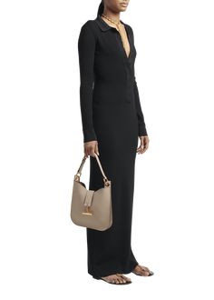 "Find TOM FORD Tara Small Hobo Crossbody In Grained Leather on Editorialist. TOM FORD \"Tara\" crossbody bag in grain leather, faux leather (polyurethane), and brass Detachable, adjustable shoulder strap Detachable, adjustable crossbody strap Can be worn as a shoulder or crossbody bag Open top with center T-strap magnetic closure Interior, one zip pocket Lining: Polyurethane Approx. 9.8\"H x 9.8\"W x 0.8\"D Item Weight (Lbs.): 1.5 Made in Italy" Leather Handled Shoulder Bag For Evening In Fall, Fall Evening Shoulder Bag With Leather Handles, Fall Evening Shoulder Bag With Leather Lining, Tom Ford Bags Handbags, Taupe Smooth Grain Shoulder Bag, Brown Top Handle Hobo Bag With Gold-tone Hardware, Taupe Leather-handled Rectangular Shoulder Bag, Taupe Crossbody Bag With Gold-tone Hardware, Hobo Shoulder Bag