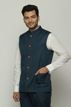 Teal blue sleeveless bundi in silk base with all over stripe stitch line detailing. - Aza Fashions Festive Blue Nehru Jacket With Stand Collar, Blue Cotton Nehru Jacket With Long Sleeves, Festive Blue Nehru Jacket, Traditional Unstitched Blue Nehru Jacket, Luxury Single-breasted Long Sleeve Nehru Jacket, Nehru Jacket, Stripes Texture, Nehru Jackets, Stitch Lines