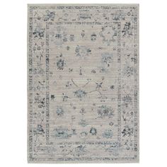 an area rug with blue and white flowers on it