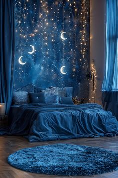 a bedroom with stars and moon lights on the wall