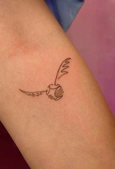 a small bird tattoo on the right thigh