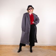 Vintage 80s trench coat, Minimalist Oversized long puffer coat in gray, Size 54/ L - Great vintage capsule wardrobe piece. - Minimalist and retro, perfect as a classic trench coat, or duster. - Light weight, cool zipper chest pocket - 35% cotton, 65% polyester; machine washable - Brand: -, Made in Yugoslavia - Excellent condition with light signs of wear, has a repair on the pocket. MISSING belt! Has belt loops. Red belt not included. - Tag size 54, estimated L. Please see the exact measurements Vintage Oversized Long Outerwear, Vintage Long Cotton Outerwear, Long Duster Coat, 80s Trench Coat, Vintage Single-breasted Long Coat, Vintage Capsule Wardrobe, Vintage Gray Single-breasted Outerwear, Capsule Wardrobe Pieces, Long Puffer Coat