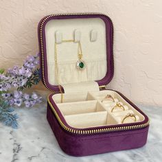 The perfect jewelry travel case for all your precious jewels! This suede jewelry box can hold rings, pendants and earrings and bracelets. The dividers in the compartment are removable, so you can easily adjust the distance between each divider or remove them completely if you prefer to have more open space for larger bangles etc. Stamped with "La Kaiser" on the zipper. Keep your jewels safe and organized with this perfect little suede case! Available in 5 different colors - deep mauve, champagne Portable Gold Jewelry Storage For Travel, Elegant Portable Rectangular Jewelry Case, Elegant Portable Rectangular Jewelry Storage Case, Elegant Portable Jewelry Storage In Rectangular Case, Elegant Rectangular Jewelry Storage For Everyday Use, Luxury Rectangular Jewelry Storage Case Gift, Adjustable Rectangular Jewelry Storage For Travel, Elegant Gold Jewelry Storage For Travel, Elegant Portable Rectangular Jewelry Storage