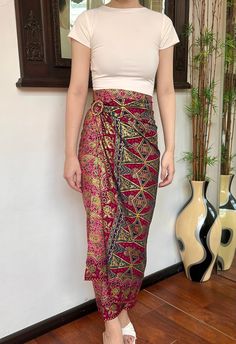 Pink Gold Ethnic Bali Batik Wrap Skirt HOW TO STYLE: This is instant wrap skirt, very easy to style.  You can wear this batik wrap skirt from day to night, as a beach cover up or style it with a top for a formal event. You can even turn this skirt into a beautiful dress.  Perfect for Bridesmaid Gift, Valentine's Day Gift, Mother's Day Gift, Birthday Gift for Her. MATERIALS: Cotton Batik  Batik handcrafted in Bali Self Manufactured  Size inclusive❗️Contact us for custom size ✅ MEASUREMENTS: Size: 150x100cm Belt buckle are given for each Batik Skirt NOTE: Please note that color might be slightly different due to monitor settings. Batik Skirt Outfits, Outfit Bali, Indian Wrap Skirt, Sarong Wrap Skirt, Mode Batik, Batik Skirt, Modern Batik, Silk Wrap Skirt, Bali Beach