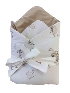 a white and brown blanket wrapped in fabric