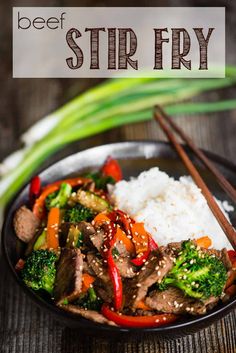 beef and broccoli stir fry in a bowl with chopsticks on the side