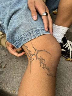 a person with a tattoo on their leg