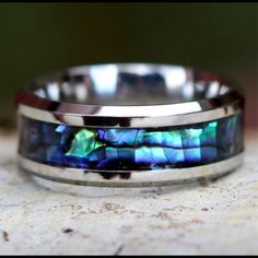 a wedding band with an abangani shell inlay