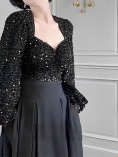 This is perfect for those who are looking for a clothing for a good price. It is fashionable, stylish, and it will look great on anyone who wears it. Do you wanahavit? Elegant Black Top For Evening, Elegant Black Evening Top, Chic Black Party Blouse, Evening Black Blouse, Black Top For Winter Party, Elegant Black Blouse For Night Out, Black Sequin Blouse For Date Night, Black Party Blouse, Black Winter Party Top