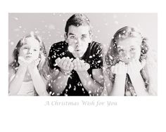 three people standing in front of a white background with snow falling down on them and the words, a christmas wish for you