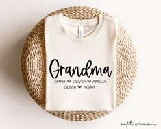 a white t - shirt with the word twins mama printed on it next to a wicker basket