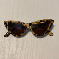 Leopard Print Retro Cat Eye Sunglasses Color Leopard Print Condition: Never Worn Runs Small Casual Brown Cat Eye Sunglasses With Tinted Lenses, Casual Brown Cat Eye Sunglasses, Casual Brown Cat Eye Sunglasses With Polarized Lenses, Casual Brown Polarized Cat Eye Sunglasses, Brown Cat Eye Sunglasses For The Beach, Brown Cat Eye Sunglasses For Beach, Retro Brown Cat Eye Sunglasses For Beach, Retro Brown Cat Eye Sunglasses With Mirrored Lenses, Leopard Print Cat Eye Sunglasses For Summer