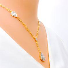 Emanating luxury and sophistication, this 18k yellow gold necklace, with a substantial weight of 9.1 grams, exquisitely showcases a radiant interlinked drop design. It boasts an impressive 0.84 carats of G-H color, VS clarity round and baguette-cut diamonds, creating a dazzling spectacle. The elongated 1.5-inch drop pendant adds an extra dimension of elegance to this piece. With a generous 20-inch length and 2.5-inch adjustable link segment, this necklace offers both style and versatility. PRODU Gold Diamond Necklace With Rectangular Diamond Accents, Gold Rectangular Necklace With Diamond Accents, Luxury Gold Diamond Necklace With Rectangular Pendant, Gold Diamond Accent Rectangular Necklace, Yellow Gold Jewelry With Diamond Accents Rectangular Pendant, 18k Gold Necklace, Baguette Cut, Baguette Cut Diamond, Drops Design