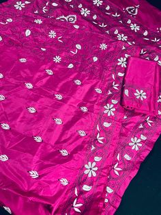 Gorgeous Magenta Pink color saree with handwoven Kantha stitch work in Black and White color. Please note - The edging on the pallu end is done by the weaver with the same kantha stitch work and not done with machine. Item: SareeColor : Magenta Pink, White and Black.Base Fabric: Bangalori Silk Blouse piece : YesBlouse material: Bangalori Silk Work: Handloom, Kantha Work Fall & Edging (Yes/No) : Yes Occasion: Party, Festival, Traditional, Religious, House-warming.Disclaimer -:- Color variation is Traditional Pre-draped Saree With Dori Work For Eid, Embroidered Silk Pre-draped Saree For Puja, Eid Tussar Silk Pre-draped Saree With Dori Work, Pink Pre-draped Saree With Motifs, Festive Pink Pre-draped Saree With Motifs, Diwali Multicolor Embroidered Art Silk Saree, Embroidered Semi-stitched Pre-draped Saree For Traditional Ceremonies, Embroidered Saree For Puja During Navratri, Embroidered Banarasi Silk Saree For Puja