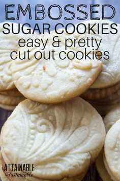 some cookies are stacked on top of each other with the words, embossed sugar cookies easy and pretty cut out cookies