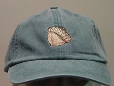 NEW EMBROIDERED ACORN MEN WOMEN WILDLIFE BASEBALL HAT  AUTUMN OAK TREE HAT (HATS SHOWN ARE FOREST GREEN, WHITE, BLACK, CARIBBEAN BLUE, NAVY BLUE AND BURGUNDY) Adams Optimum 6 Panel Baseball Hat Low Profile - 100% Cotton Twill Adult Cap Pigment Dyed - Garment Washed Hat 6 Panels with Sewn Matching Eyelet Visor with 3 Rows of Stitching Pre-formed Bill - Leather Strap with Brass Grommet Adjustable - One Size Fits Most An Extremely Comfortable Baseball Hat! Enjoy the Embroidered Oak Acorn Hat Please Choose Your Color Hat We have 24 Different Solid Color Baseball Hats Available Thanks for Shopping at Price Embroidery & Apparel! Acorn Hat, Sunflower Hat, How To Wash Hats, Embroidery On Clothes, Flower Hats, Embroidered Hats, Dad Caps, Autumn Forest, Periwinkle Blue