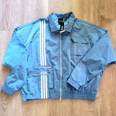 Adidas Originals Ivy Park Lite Blue Nylon *Unisex* Track Jacket Men's/Women's Xl Style #: H33303 Condition: Brand New With Tags Ready To Be Shipped. Please Feel Free To Message Me If Additional Photos Are Needed. **All Items Shipped The Same Day!!*** Urban Blue Nylon Outerwear, Blue Nylon Track Jacket For Fall, Functional Blue Track Jacket With Pockets, Blue Nylon Track Jacket For Spring, Blue Sportswear Outerwear For Spring, Casual Blue Nylon Track Jacket, Blue Nylon Long Sleeve Track Jacket, Blue Spring Sportswear Outerwear, Blue Long Sleeve Nylon Track Jacket