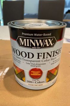 a can of minwax wood finish sitting on a table