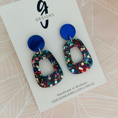 Acrylic - Statement Earrings  - Hollow Trapezium Drop - Dangles - Rainbow Glitter - Royal Blue Mirror Stud Top Free Aus Shipping. If you love colour and sparkle, these are the earrings for you! A 1.4cm mirror stud top with a 3.3cm hollow trapezium dangle in rainbow glitter. Super light-weight and comfortable to wear! All GDesignsJewellery posts and backs are stainless steel suitable for most sensitive ears. FREE Aus Shipping:   Sent as Large Letter via Australia Post.  Allow at least approx. 10-20 days depending on your location.  Hopefully sooner, dependent on Aus Post! Multicolor Pierced Earrings For Party, Trendy Silver Glitter Earrings, Trendy Glitter Earrings For Party, Blue Glitter Jewelry For Party, Multicolor Glitter Drop Earrings, Multicolor Glitter Dangle Earrings, Blue Glitter Dangle Earrings, Iridescent Glitter Earrings For Party, Elegant Glitter Dangle Earrings