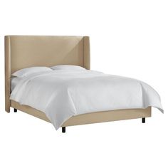 a bed with white sheets and pillows on top of it's headboard, against a white background