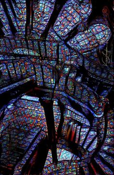 the inside of a cathedral with stained glass windows