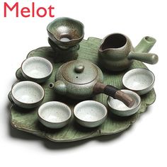 a tea set is sitting on a tray