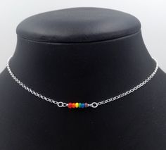 "Handmade sterling silver necklace. Dainty acrylic beads making up the LGBTQ pride flag. Delicate silver chain. Order at least 2.5 cm (1\") longer than the intended wearers neck for a tight fit. Longer for a looser fit. Matching bracelet: https://www.etsy.com/listing/992071278 Necklace and bracelet set (lower price): https://www.etsy.com/listing/1014326575 This is is a made to order listing and you'll get a necklace like the one in the pictures, not the exact copy in the pictures. Please contact Rainbow Choker Necklace As A Gift, Rainbow Choker Necklace As Gift, Multicolor Sterling Silver Beaded Necklaces For Gifts, Multicolor Sterling Silver Beaded Necklace For Gift, Sterling Silver Multicolor Beaded Necklace For Gift, Multicolor Sterling Silver Jewelry With Tiny Beads, Ornate Multicolor Beaded Sterling Silver Jewelry, Sterling Silver Beaded Necklace With Adjustable Chain For Gifts, Sterling Silver Beaded Necklace With Adjustable Chain