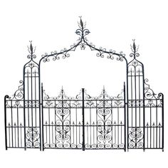 an iron gate with intricate designs on the top and bottom, set against a white background