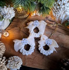 christmas decorations and pine cones on a table