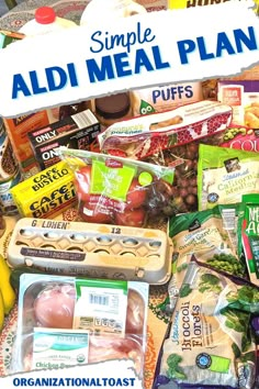 a pile of food sitting on top of a table next to a sign that says, simple aldi meal plan