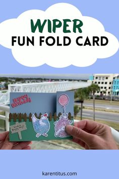 someone holding up a card with the words wiper fun fold card