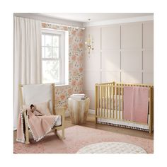 a baby's room with floral wallpaper and pink accents, including a crib