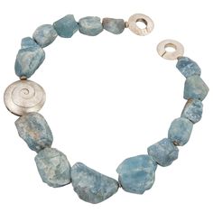 Large graduated Natural organic Aquamarine nuggets, accented with a large textured Sterling Silver swirl rondelle, inter-spaced with S/S spacers and held by a round S/S textured clasp comprising this mesmerizing necklace. Approx. necklace length 21″; Aqua nugget sizes measure approx. from 26mm×18mm to 44x28mm. More Beautiful in real timer…yours to enjoy! Wire Choker Necklace, South Sea Pearl Necklace, Necklaces Choker, Raw Gemstone Jewelry, Graduation Jewelry, Sterling Silver Choker, Necklaces Silver, Sterling Silver Heart Necklace, Pearl And Diamond Necklace