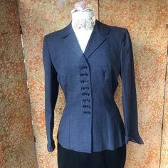 Irene Lentz designed fitted jacket in a blue-gray houndstooth pattern with double buttons down the front. Lentz was a two-time Oscar-nominated costume designer. This piece, likely part of a suit, dates from the late 1940s when she began her mass-market line with top department stores, in this case, Gunther Jaeckel of New York City.  The extremely well-tailored jacket has several unique design details that really set it apart from today's clothing- starting with the incredible double button front Irene Lentz, Slim Hips, Fitted Jacket, Costume Designer, Department Stores, Mass Market, Houndstooth Pattern, Todays Outfit, Fitted Blazer