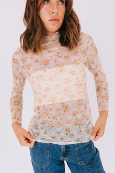 The Bloom All Day Top combines a cozy turtle neck with a feminine touch of floral printed lace and stretchy mesh. Stay chic and comfortable all day long in this playful and versatile top. Available in 2 colors! Details Turtle neck Floral printed lace Stretchy mesh Sizing Approximate measurements: SIZE LENGTH BUST Small 24" 36" Medium 26" 38" Large 26" 40" Fabric has stretchModel is 5’10 wearing small Material 95% Polyester 5% SpandexHand wash coldHang to dry 2 Colours, Turtle Neck, Floral Prints, Lace, Pink, Floral, Fabric, How To Wear, Color