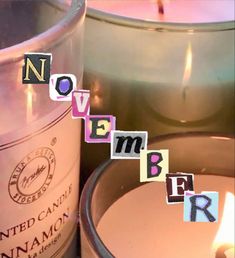 a candle that is next to some letters