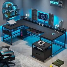 a computer desk with speakers and a soccer ball on it