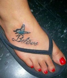 a woman's foot with the word believe tattooed on it and a butterfly tattoo