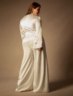 Bridal by ELOQUII Flare Sleeve Jumpsuit | Women's Plus Size Dresses | ELOQUII Bridal Styles, Bridal Jumpsuit, Silk Jumpsuit, Wedding Jumpsuit, Plus Size Jumpsuit, White Jumpsuit, Jumpsuit With Sleeves, Stretch Satin, Fitted Bodice