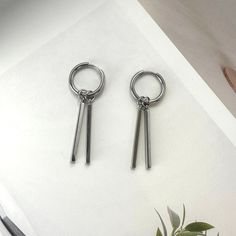 Upgrade your streetwear game with these Metal Bar Dangle Drop Earrings. They feature a unisex style that is perfect for both men and women. With a hip hop vibe and unique design, these earrings will make you stand out in any crowd. Add a touch of edgy and stylish flair to your everyday look. Earrings length 1.6 inch width 0.6 inch. Cheap Metal Earrings For Streetwear, Earrings Masculine, Eboy Earrings, Trendy Metal Earrings For Streetwear, Punk Style Pierced Earrings For Streetwear, Single Metal Earring For Streetwear, Trendy Metal Hoop Earrings For Streetwear, Silver Trendy Hoop Earrings For Streetwear, Silver Hoop Earrings For Streetwear