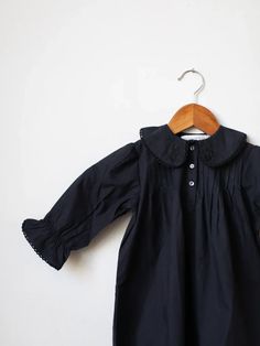 This versatile night dress, reminiscent of days spent harvesting and feeding chickens, offers more than just comfort. Crafted from premium cotton poplin and with a jet-black hue. Black Cotton Sleepwear For Fall, Black Cotton Sleepwear For Spring, Black Cotton Nightgown For Loungewear, Black Cotton Sleep Dress, Black Bedtime Dress For Spring, Black Spring Nightgown For Bedtime, Black Spring Dress For Bedtime, Black Lace Trim Dress For Bedtime, Feeding Chickens