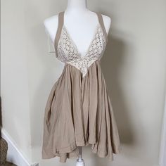 Tan Backless Free People Dress. Low V At Bust With Lace Overlay. Has Adjustable Ties On The Back For Bust And For The Skirt. Skirt Is Very Flowy For A Good Spin! Shells On The Ties. Nwot, Never Worn, No Damage. 4/15/20 Host Pick 7/20/21 Beige Backless Mini Dress For Summer, Beige Tie Back Mini Dress For Spring, Backless Beige Mini Dress For Spring, Beige Backless Mini Dress For Spring, Beige Backless Mini Dress For Brunch, Beige Backless Mini Dress For Day Out, Beige Halter Neck Mini Dress For Day Out, Brown Backless Dress For Spring, Spring Brown Backless Dress