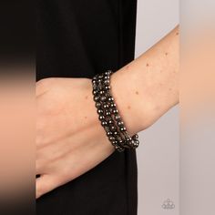 A Gritty Collection Of Smooth, Studded, And Textured Gunmetal Beads Are Threaded Along Stretchy Bands Around The Wrist, Creating Dainty Layers. Sold As One Set Of Three Bracelets. Elegant Black Metal Wrap Bracelet, Party Metal Beaded Bracelets With Black Beads, Elegant Gunmetal Metal Bracelets, Elegant Gunmetal Metal Bracelet, Adjustable Gunmetal Beaded Jewelry, Adjustable Beaded Gunmetal Jewelry, Elegant Adjustable Metal Beaded Jewelry, Black Metal Bracelet With Silver Beads, Black Beaded Metal Bracelets