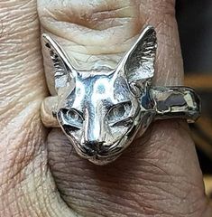 Sterling silver Abyssinian Cat ring. Original design carved in wax then lost wax cast into solid sterling silver. Shown in a size S, and adjustable to ring sizes J-Z6. First class post included. Unique Carved Adjustable Rings, Adjustable Carved Silver Ring, Sterling Silver Cat Design Rings For Anniversary, Silver Cat Design Jewelry Gift, Adjustable Sterling Silver Cat Design Rings, Copper And Pink, Silver Cat Pendant, Abyssinian Cats, Abyssinian